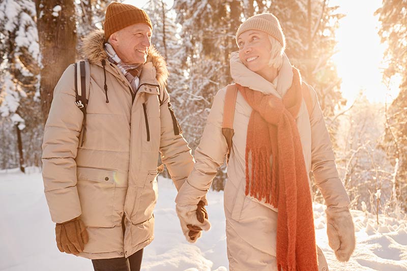 Senior couple walking outside in Winter photo